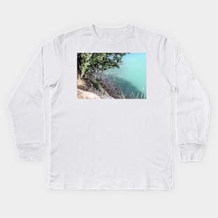 tree overhanging a rocky shore Kids Long Sleeve T-Shirt